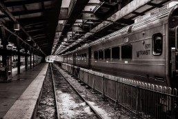 nj transit train in black and white