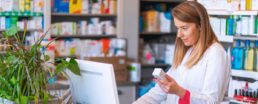 pharmacist looking at prescription